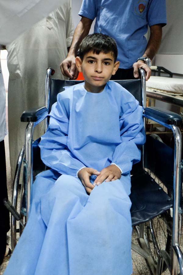 photo of Hatem being wheeled into OR