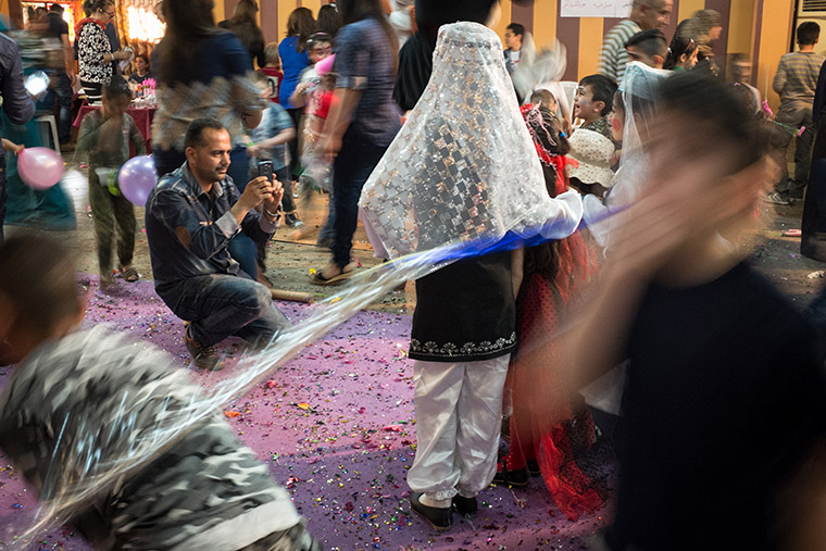 A quiet moment amid the chaos of a children's Easter party, hosted by a local Assyrian church.