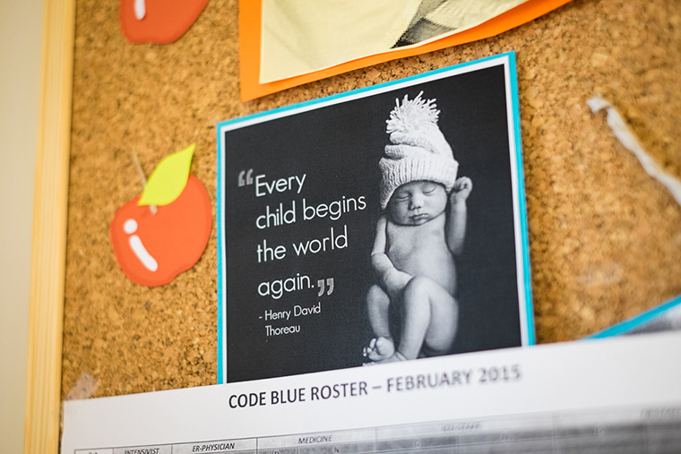 On the bulletin board in Dr. Firas' office is an image of a baby with the following Henry David Thoreau quote, "Every child begins the world again."