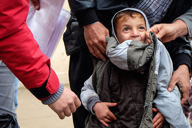 A young displaced boy got a new coat to keep him warm through the winter.