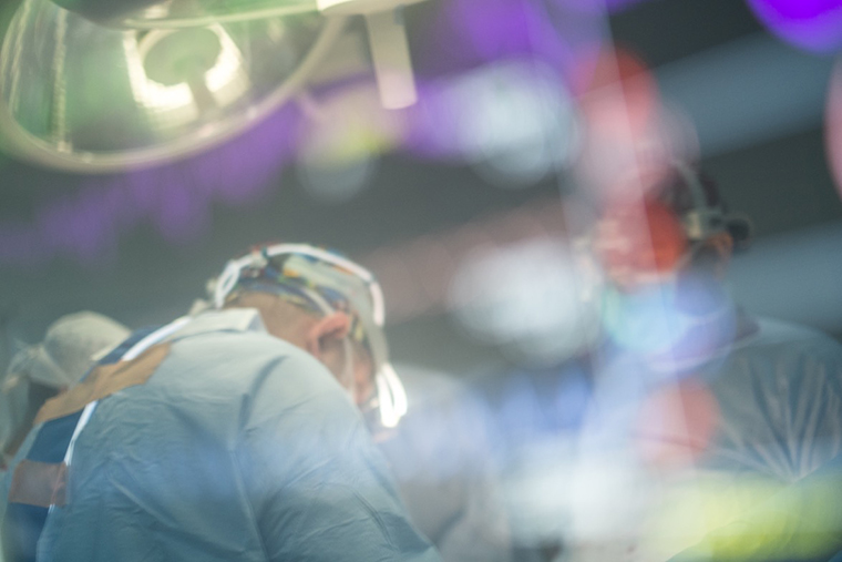 A peek through a fuzzy operating room window, at a life-saving heart surgery in process in Nasiriyah, Iraq.