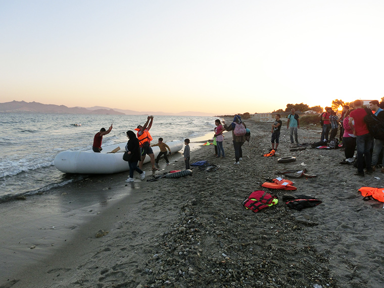 A rubber boat carrying around 50 migrants and refugees arrives from Bodrum in Turkey to the Greek island of Kos in the early hours of the morning.