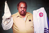 Daryl Davis holding Klan uniform