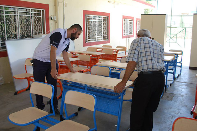 Desks and white boards are delivered to Kirkuk, for a summer education programme, which will combine students from different ethnic and religious backgrounds.