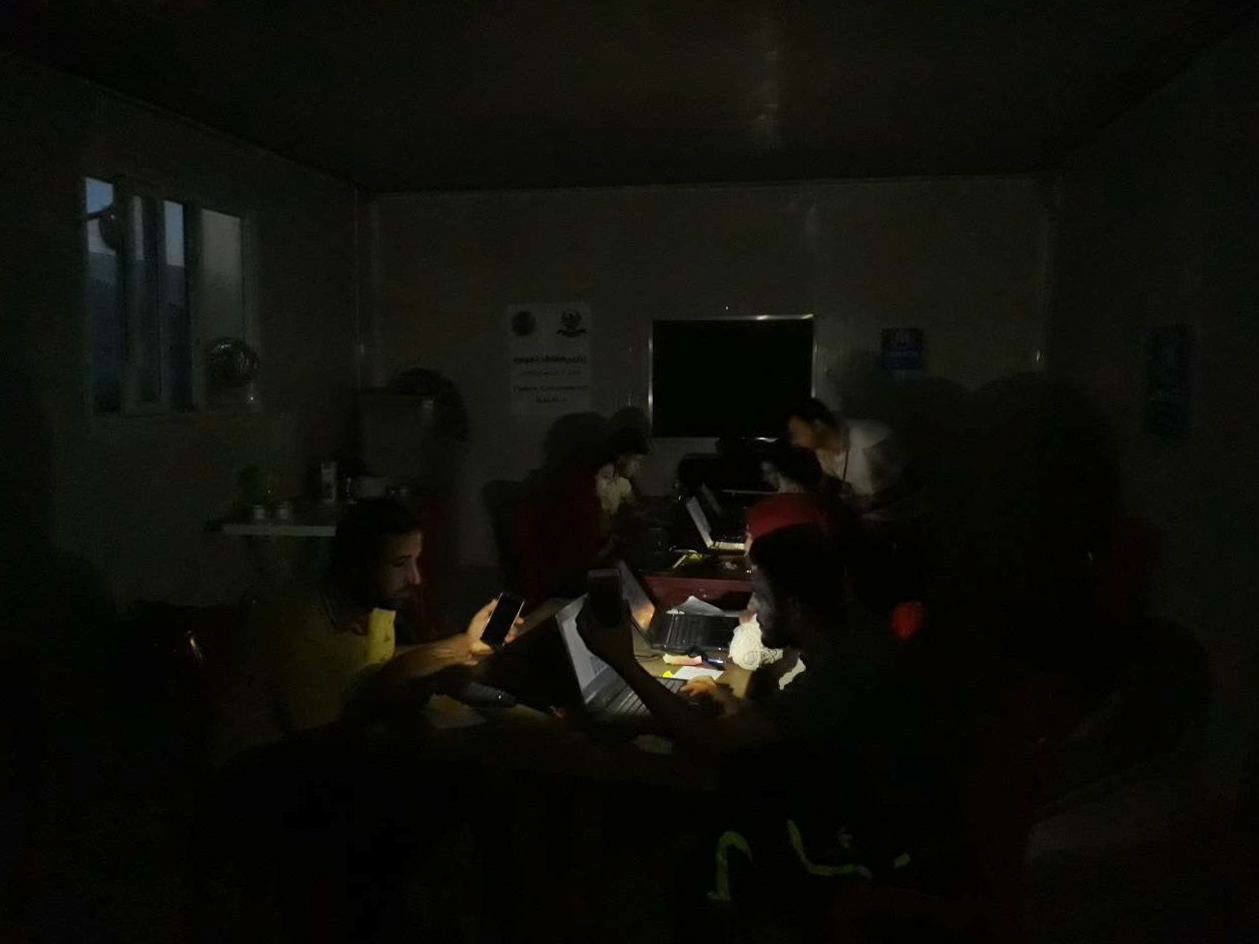 staff working in the dark