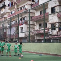 A boys' soccer team, made up of kids from a bullet-ridden neighborhood in Lebanon, make friends on the field.